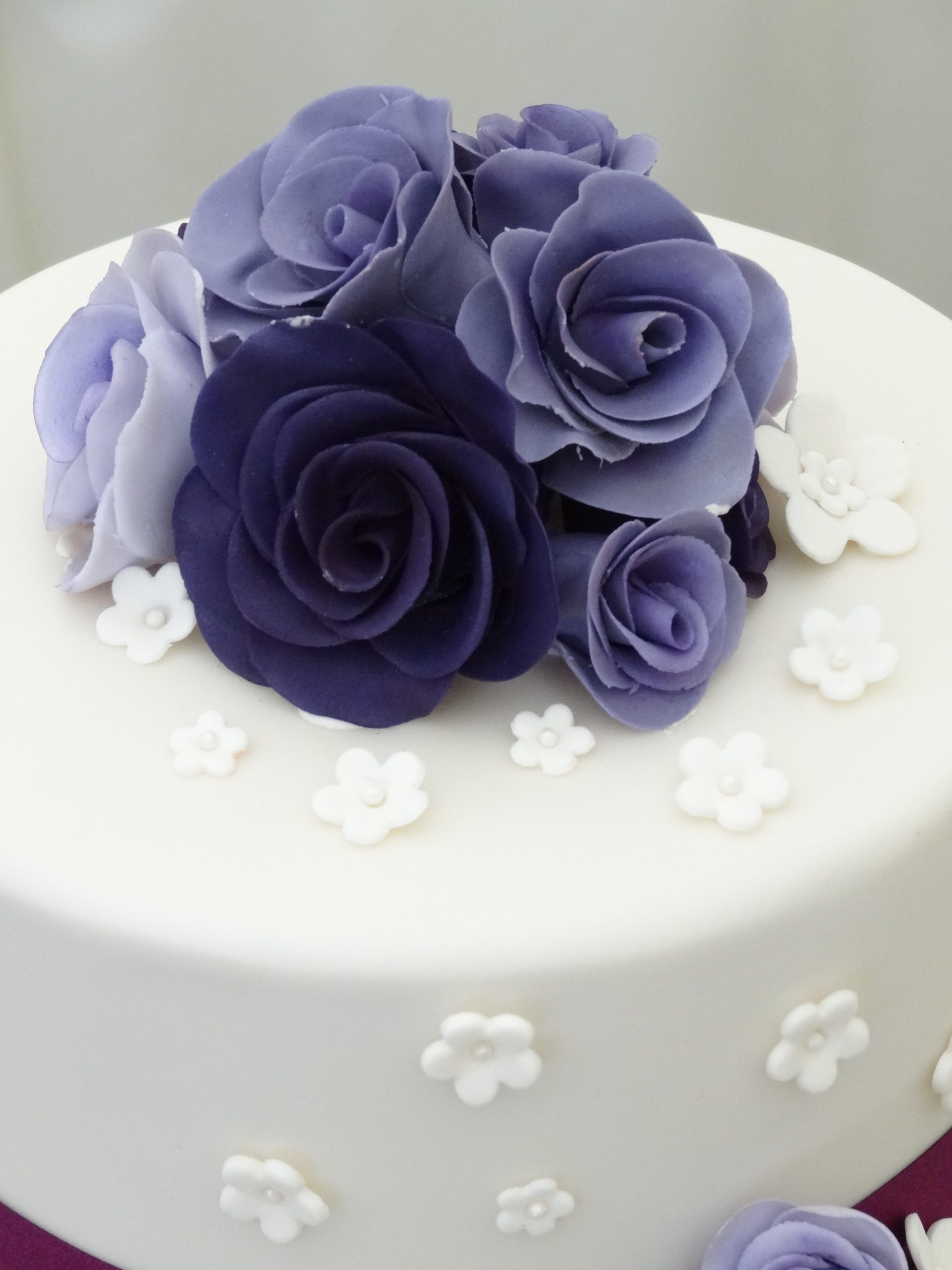 Purple roses wedding cake